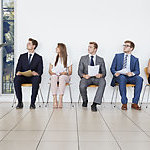 Recruiter and people waiting for job interviews, full length