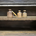 old weights  on work bench - vintage kg weights on wooden background