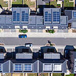 Overhead aerial view of a newly built housing development with solar panels installed in all the homes helping to aid sustainable living.